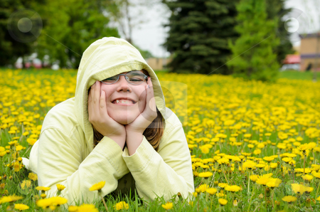 To use this stock image in your creative project, please select the size you need over to the right and click the "Add to Cart" button.
Your downloaded image will come with the Cutcaster watermark removed so don’t worry about the watermark you see on this page. Field of Dandelions Portrait stock photo, A young girl lying in a field of dandelions. by Richard Nelson