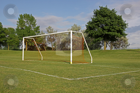 To use this stock image in your creative project, please select the size you need over to the right and click the "Add to Cart" button.
Your downloaded image will come with the Cutcaster watermark removed so don’t worry about the watermark you see on this page. Empty Football Net stock photo, An empty soccer goal with trees in the background.
by Chris Hill