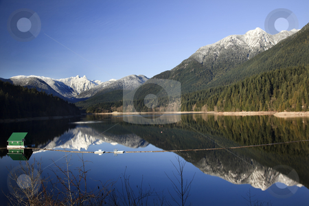 To use this stock image in your creative project, please select the size you need over to the right and click the "Add to Cart" button.
Your downloaded image will come with the Cutcaster watermark removed so don’t worry about the watermark you see on this page. Capilano Reservoir Lake Snowy Two Lions Mountains Vancouver Brit stock photo, Capilano Reservoir Lake Long Reflection Green Building Dam Snowy Two Lions Snow Mountains Vancouver British Columbia Pacific Northwest by William Perry