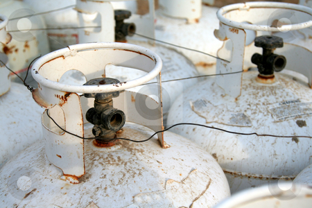 To use this stock image in your creative project, please select the size you need over to the right and click the "Add to Cart" button.
Your downloaded image will come with the Cutcaster watermark removed so don’t worry about the watermark you see on this page. Propane Tanks stock photo, The top of a bunch of propane tanks. by Chris Hill