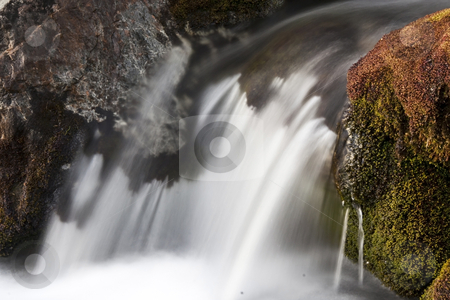 To use this stock image in your creative project, please select the size you need over to the right and click the "Add to Cart" button.
Your downloaded image will come with the Cutcaster watermark removed so don’t worry about the watermark you see on this page. Waterfall stock photo, Beautiful waterfall in mountain by Sasas Design