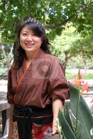 To use this stock image in your creative project, please select the size you need over to the right and click the "Add to Cart" button.
Your downloaded image will come with the Cutcaster watermark removed so don’t worry about the watermark you see on this page. Japanese women stock photo, portrait of a Japanese woman with traditional clothing by Henrik Lehnerer