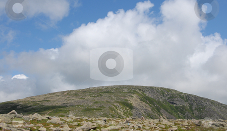 To use this stock image in your creative project, please select the size you need over to the right and click the "Add to Cart" button.
Your downloaded image will come with the Cutcaster watermark removed so don’t worry about the watermark you see on this page. Rolling clouds stock photo, A view of Mt. Kathdin in Maine during the summer time. With clouds rolling over. by Tim Markley