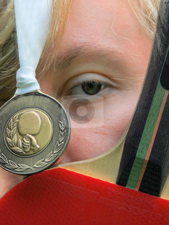 To use this stock image in your creative project, please select the size you need over to the right and click the "Add to Cart" button.
Your downloaded image will come with the Cutcaster watermark removed so don’t worry about the watermark you see on this page. Table Tennis Gold stock photo, A Young Female with Table Tennis Bat and Gold Medal. by Lucy Clark