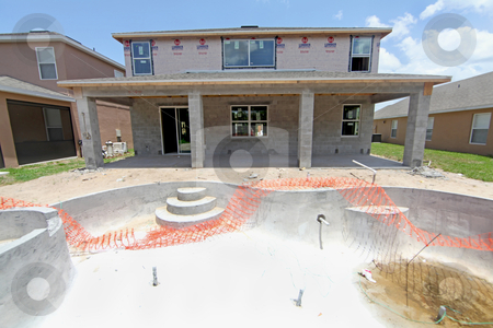 To use this stock image in your creative project, please select the size you need over to the right and click the "Add to Cart" button.
Your downloaded image will come with the Cutcaster watermark removed so don’t worry about the watermark you see on this page. House and Pool Construction stock photo, A large House and Pool under construction by Lucy Clark