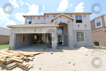 To use this stock image in your creative project, please select the size you need over to the right and click the "Add to Cart" button.
Your downloaded image will come with the Cutcaster watermark removed so don’t worry about the watermark you see on this page. House Construction stock photo, A large house under construction in Florida by Lucy Clark