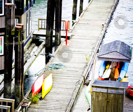 To use this stock image in your creative project, please select the size you need over to the right and click the "Add to Cart" button.
Your downloaded image will come with the Cutcaster watermark removed so don’t worry about the watermark you see on this page. Footbridge stock photo, lake footbridge view from above, with water poles and kayaks by Anatoliy Nykilchyk
