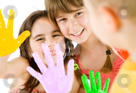 To use this stock image in your creative project, please select the size you need over to the right and click the "Add to Cart" button.
Your downloaded image will come with the Cutcaster watermark removed so don’t worry about the watermark you see on this page. Children painted hands playing stock photo, Close-up of two little girls showing their painted colourful hands to a boy, focus on girls by vilevi