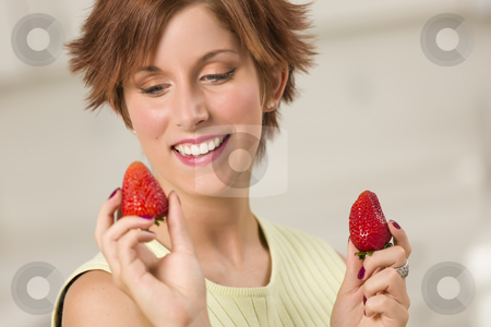 To use this stock image in your creative project, please select the size you need over to the right and click the "Add to Cart" button.
Your downloaded image will come with the Cutcaster watermark removed so don’t worry about the watermark you see on this page. Pretty Red Haired Woman Holding Strawberry stock photo, Pretty Red Haired Woman Holding Strawberry in Her Kitchen. by Andy Dean