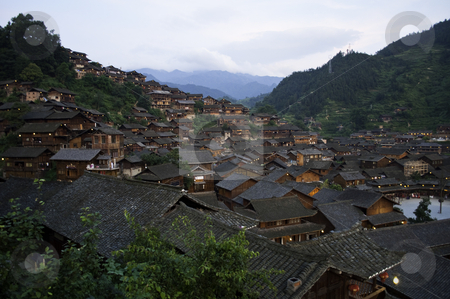To use this stock image in your creative project, please select the size you need over to the right and click the "Add to Cart" button.
Your downloaded image will come with the Cutcaster watermark removed so don’t worry about the watermark you see on this page. Old Chinese Village stock photo, A old miao chinese village with tradtional style houses by elemery