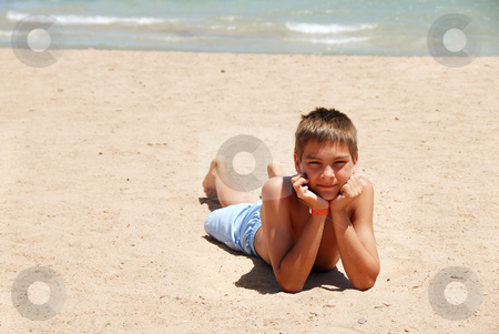 To use this stock image in your creative project, please select the size you need over to the right and click the "Add to Cart" button.
Your downloaded image will come with the Cutcaster watermark removed so don’t worry about the watermark you see on this page. Boy lying on the beach stock photo, caucasian boy lying on the sand beach in Egypt by Julija Sapic