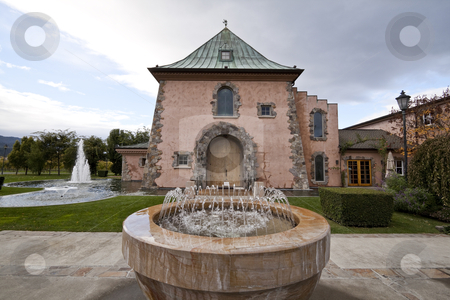 To use this stock image in your creative project, please select the size you need over to the right and click the "Add to Cart" button.
Your downloaded image will come with the Cutcaster watermark removed so don’t worry about the watermark you see on this page. Fountains stock photo, A bunch of fountains around the entrance of a building by Kevin Tietz