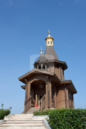To use this stock image in your creative project, please select the size you need over to the right and click the "Add to Cart" button.
Your downloaded image will come with the Cutcaster watermark removed so don’t worry about the watermark you see on this page. Small wooden church stock photo, small wooden church with golden roof by meccasky