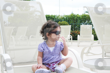 To use this stock image in your creative project, please select the size you need over to the right and click the "Add to Cart" button.
Your downloaded image will come with the Cutcaster watermark removed so don’t worry about the watermark you see on this page. Adorable young baby girl wearing sunglasses in flirting position stock photo, adorable young baby girl wearing sunglasses in flirting position by dacasdo
